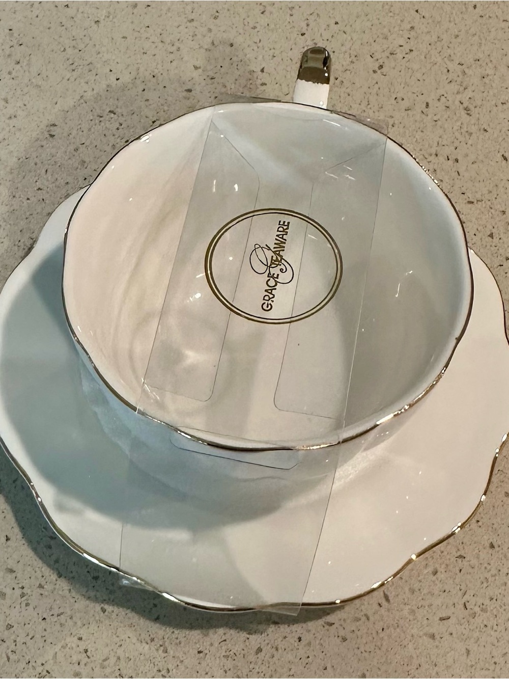 Grace White Porcelain Tea Cup and Saucer with Gold Trim